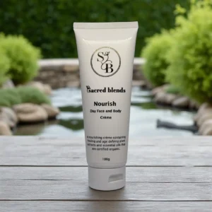 Nourish Day Face and Body Crème by Sacred Blends in a 100ml tube with a white label.